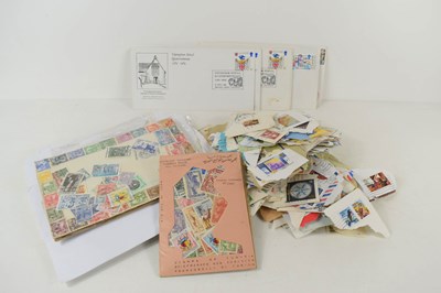 Lot 323 - A collection of loose stamps and first day...