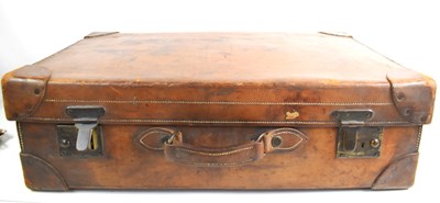 Lot 168 - A vintage leather suitcase, with initials to...