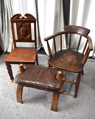 Lot 534 - An antique smokers bow armchair, a camel...