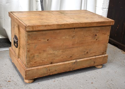 Lot 531 - An antique pine chest, with iron handles to...