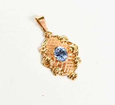 Lot 228 - An 18ct gold and blue topaz set pendant, the...