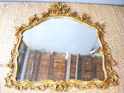 Lot 475 - A Regency style overmantle mirror, within a...