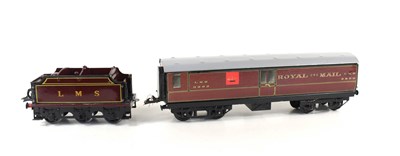 Lot 402 - A tin plate railway carriage and LMS Hornby...