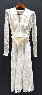 Lot 172 - A vintage wedding dress, satin and lace with...