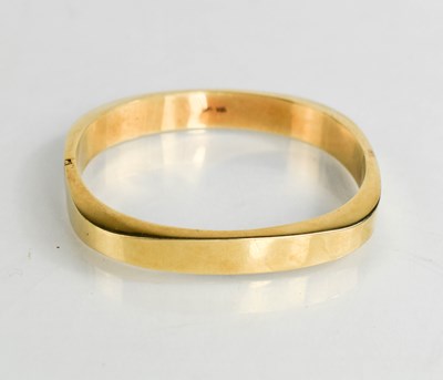 Lot 5 - A 14ct gold bangle, of square form with...