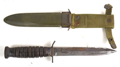 Lot 71 - A US WWII era M3 fighting knife, the hilt...