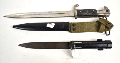 Lot 144 - A Belgian FAL Type C bayonet with scabbard,...