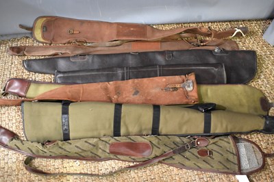 Lot 44 - A collection of leather and canvas gun slips...