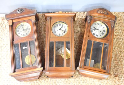 Lot 217 - A group of three regulator style wall clocks,...