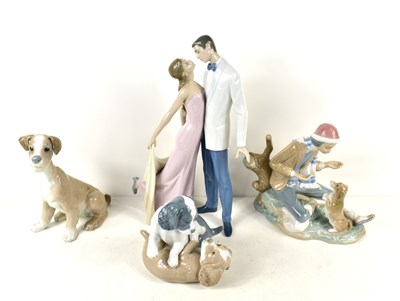 Lot 290 - A pair of Lladro Nao porcelain dog figurines...
