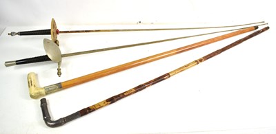 Lot 113 - A pair of walking canes, one bamboo with...
