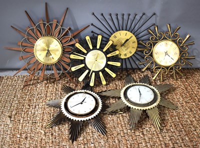 Lot 229 - A group fo star burst clocks of various...