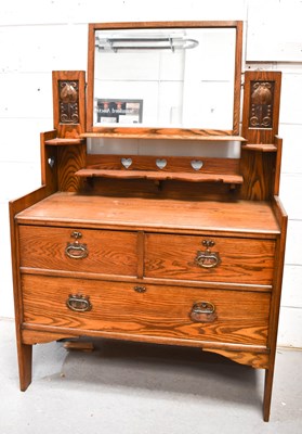 Lot 581 - An Arts & Crafts period dressing chest likely...