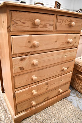 Lot 552 - A 20th century pine chest of drawers having...