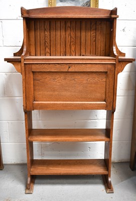 Lot 575 - An Arts & Crafts period oak secretaire...