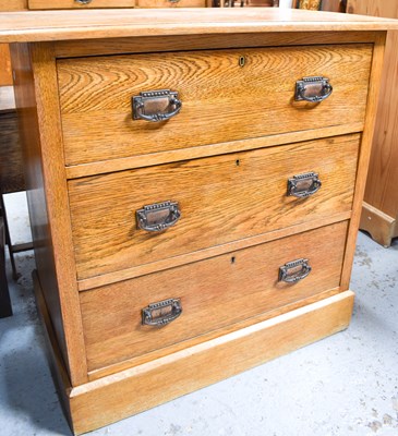 Lot 566 - An Arts & Crafts period oak chest of drawers,...