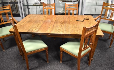 Lot 580 - An Arts & Crafts period set of six oak dining...