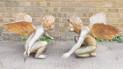 Lot 388 - A pair of silvered/gold metal bronze cherub...