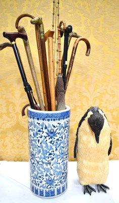 Lot 549 - A group of vintage walking canes and umbrellas...