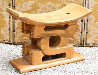 Lot 391 - An African Ashanti stool, carved in pale...