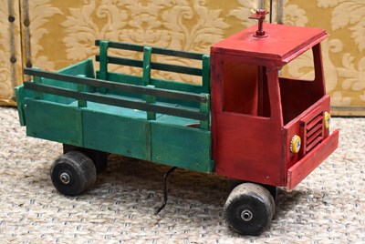 Lot 392 - An African handmade and painted wooden truck,...