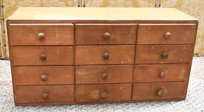 Lot 555 - A wooden tool chest of twelve drawers, 43cm...