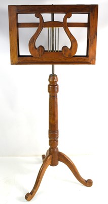 Lot 558 - A 19th century style oak adjustable music...