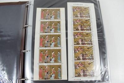 Lot 397 - An album containing mint and used Japanese...