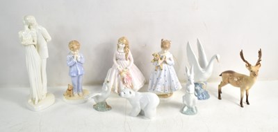 Lot 312 - A group of porcelain figures and animals to...