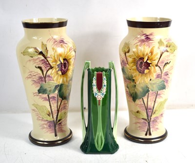 Lot 307 - An Art Nouveau green twin handled vase by...