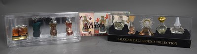 Lot 30 - Three boxes of miniature perfume bottles, two...