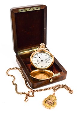 Lot 135 - A 9ct gold Albert chain with a 9ct gold medal...