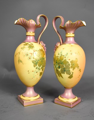 Lot 77 - A pair of Royal Worcester ivory and peach...