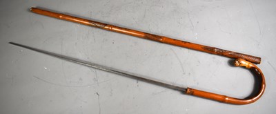 Lot 247 - A 19th century carved bamboo sword stick with...