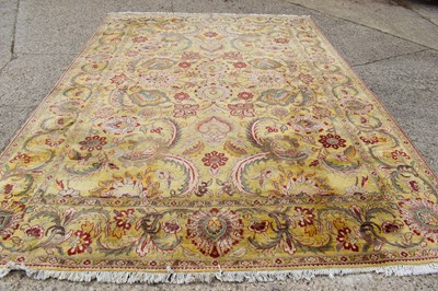 Lot 421 - A large Indian woollen rug, with serrated...