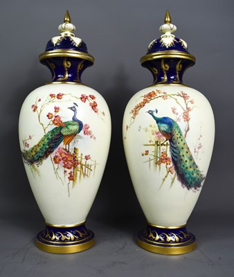 Lot 96 - A pair of Royal Worcester vases and covers,...