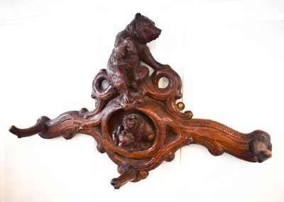 Lot 287 - A 19th century Black Forest coat hook, carved...