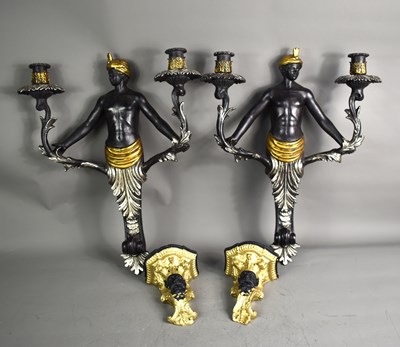 Lot 372 - A pair of 19th century black and gilt mask...