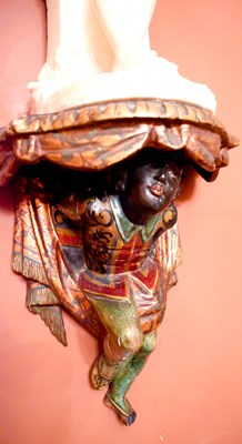 Lot 442 - A 19th century gilt and painted blackamoor...