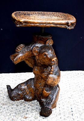 Lot 480 - A 19th century Black Forest bear stool, the...