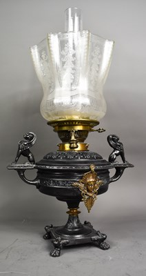 Lot 365 - A 19th century cast oil lamp, the bowl mounted...