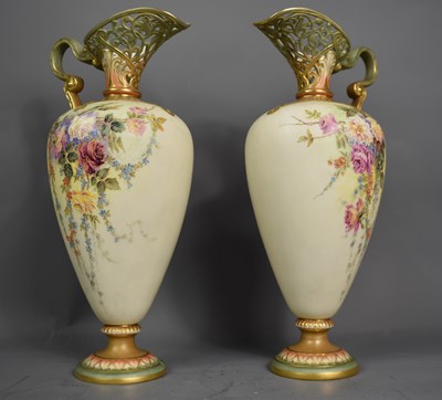 Lot 97 - A  pair of Royal Worcester ewers, the ivory...