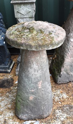 Lot 518 - A 19th century stone saddle stone, 83cm by 52cm