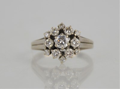 Lot 33a - A 14ct white gold and diamond dress ring of...