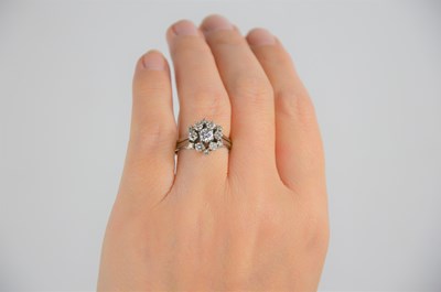 Lot 33 - A 14ct white gold and diamond dress ring of...