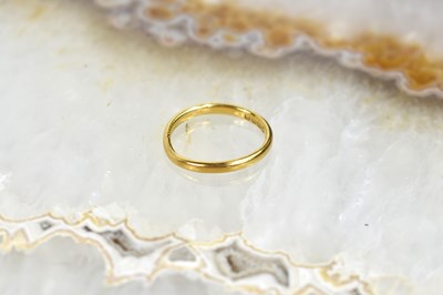 Lot 87 - A 22ct gold wedding band, size G, 2g.