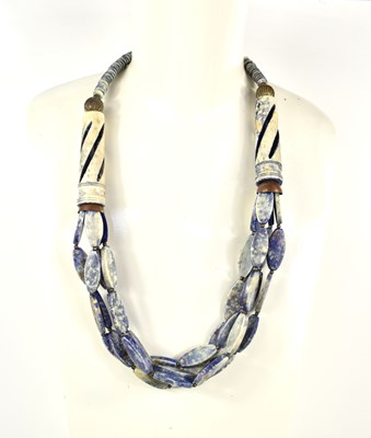 Lot 36 - A natural sodalite carved stone necklace.
