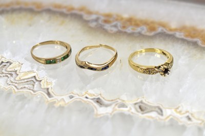 Lot 150 - A group of three 9ct gold rings set with...