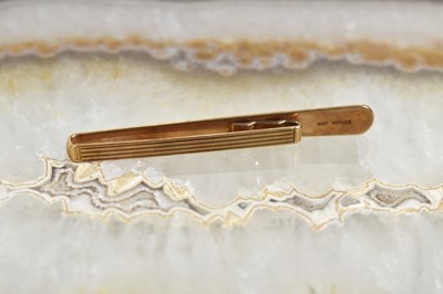 Lot 179 - A 9ct gold tie clip, circa 1970s, 7.4g.