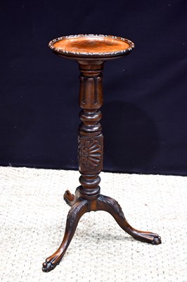 Lot 427 - A 19th century mahogany torchere, standing on...